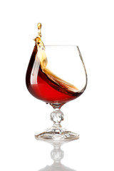 Splash of cognac in glass