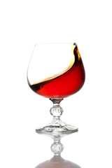 Splash of cognac in glass