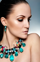 glamor sexy brunette model bright makeup with accessory jewelery