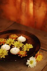 Obraz na płótnie Canvas Aroma Bowl With Candles And Flowers