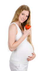 Healthy pregnant lady with tomato. isolated on white