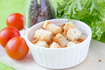 Crouton in white ceramic cup