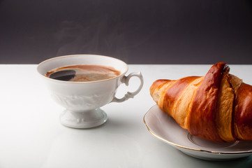 Croissant and a cup of delicious coffee