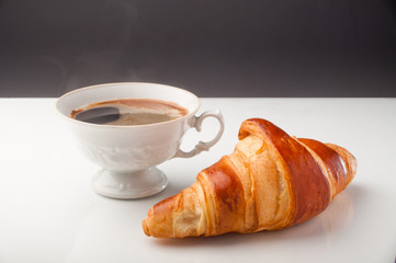 Croissant and a cup of delicious coffee