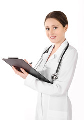 Smiling young doctor woman with plane table isolated