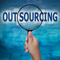 OUT SOURCING in Magnifying glass on blue background