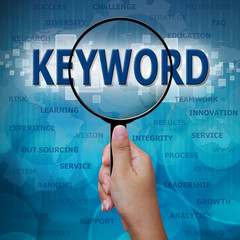 KEYWORD in Magnifying glass on blue background