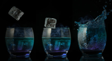 Serial arrangement of ice falling into glass of blue liquid
