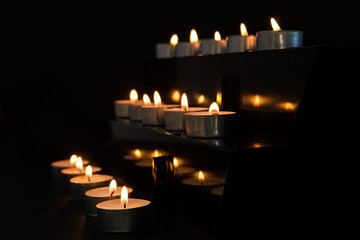 Candles at the alter in the darkness