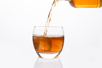 Whisky  bottle pouring into glass