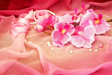 Pink orchids, necklace and beads