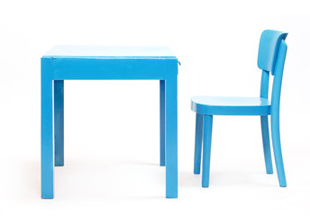 Classic wooden table and chair on a white background.