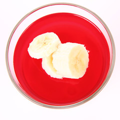 Pudding dessert with bananas and raspberry jelly