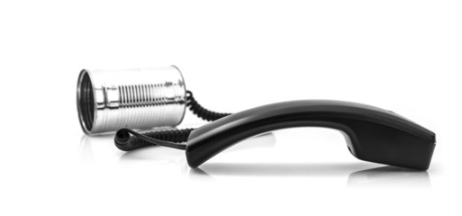 Tin can phone with handset on white background