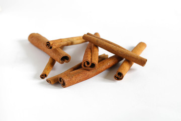 Cinnamon bark stick heap isolated on white