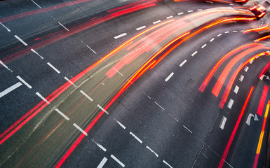 Motion blurred city road traffic (color toned  image)