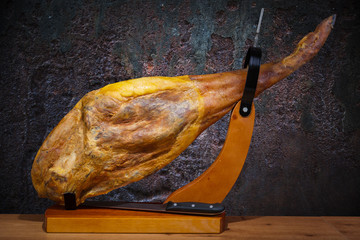 Full leg of Spanish jamon iberico (ham) in a cave - obrazy, fototapety, plakaty