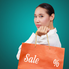 Beautiful shopping woman holding shopping bags.