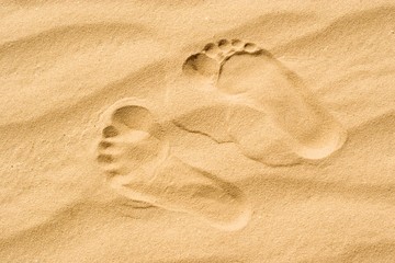 Fototapeta na wymiar Two footprints in the sand in the desert