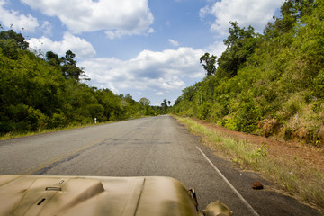 Jeep driving along a street in Asia