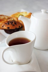 tea cup  muffin and danish