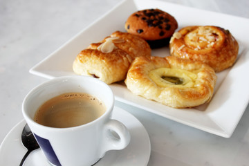 coffee cup  muffin and danish