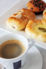 coffee cup  muffin and danish