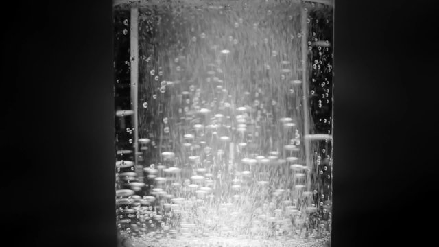 Aspirin tablet in glass of water