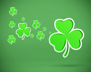 Green shamrocks on green background