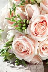 wedding bouquet of white freesias and pink roses