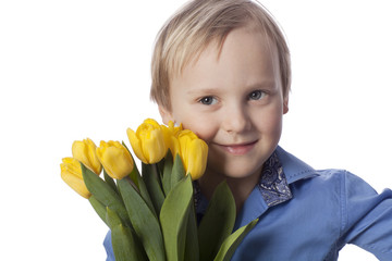 boy with yellow tulips is looking to the right