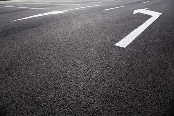 Arrow signs as road markings on a street