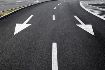 Arrow signs as road markings on a street