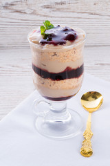 vanilla pudding with cherry and biscuit