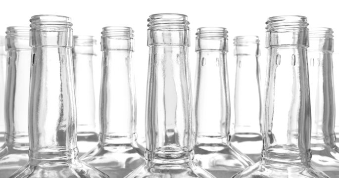 Glass bottles on white background