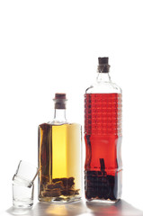 two bottles of homemade liquor isolated on white background