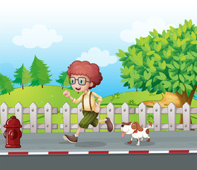 A boy running along the road with his pet