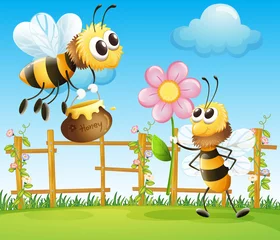 Fotobehang Twee grote bijen in de tuin © GraphicsRF