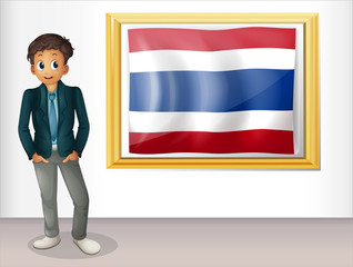 A boy with a framed flag of Thailand