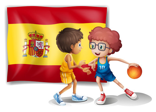 Boys playing basketball with the flag of Spain