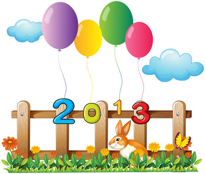 Four colorful balloons near the wooden fence with a bunny
