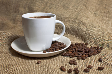 Cup of coffee and coffee beans