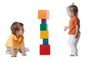little kids plays with cubes