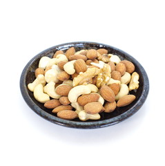 Various mixed nuts isolated on white background