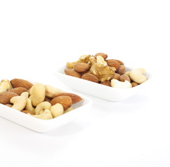 Various mixed nuts isolated on white background