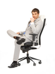 young businessman sitting in chair