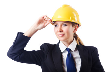 Young businesswoman with hard hat on white