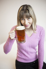 Young Woman Drinking Mug of Beer