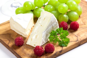 French cheese with raspberries and grapes