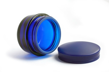 Empty glass can for cream isolated on white background